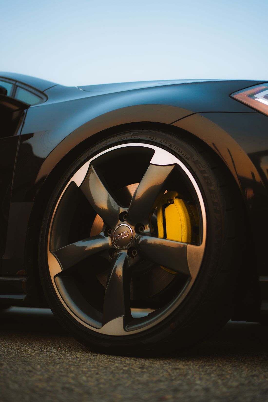 Lowered car with alloy wheel and yellow brake caliper